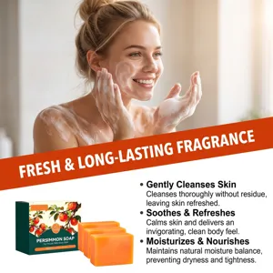 Smiling woman lathers her skin with foam beside orange soap bars and persimmon soap packaging