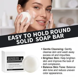 Lifestyle close-up of a woman washing her face with a round white soap bar and rich foam
