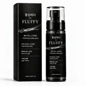Volumegevende haarspray in zwarte flacon van 100 ml naast de bijpassende doos, frontaal afgebeeld