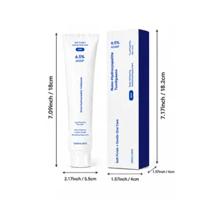 White toothpaste tube and box with blue accents, shown beside height and width measurements