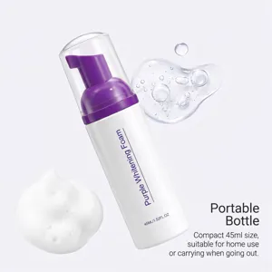 Detail view of a white 45 ml bottle with a purple pump, foam texture and clear liquid droplets