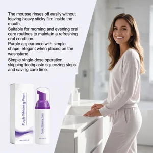Purple oral care foam bottle and carton shown beside a smiling woman at a bathroom sink