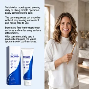 Blue-and-white toothpaste packaging beside a smiling woman holding a bamboo toothbrush.