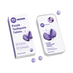 Purple peppermint toothpaste tablets in a carton and metal tin, with loose tablets shown