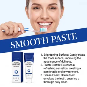 Smiling woman holds a toothbrush above a toothpaste box and tube, with whitening text beside them