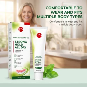 Denture gel box and tube beside fresh mint leaves, with a smiling woman blurred in a bathroom setting