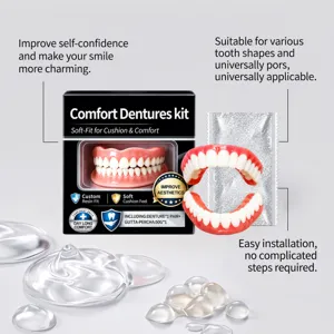 Front view of pink-and-white dentures beside a black kit box and clear cushion gel pieces