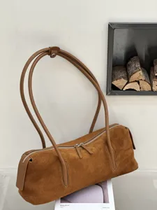 Brown suede-textured bag displayed with curved leather straps and a silver zipper in view