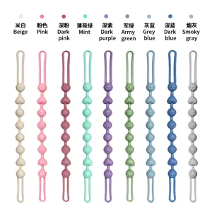 Silicone pacifier clip chain with decorative beads, shown in nine colors on a white background