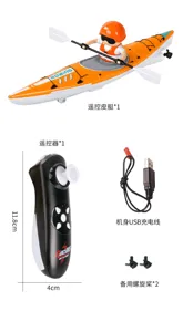 Detail view of orange-and-white kayak, seated figure, remote control, USB cable and spare propellers