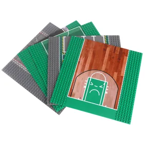 Five-piece building block baseplate set in green and gray, with road and basketball court designs