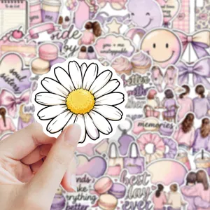Pink and purple decorative sticker set with a white daisy sticker held up against the collage