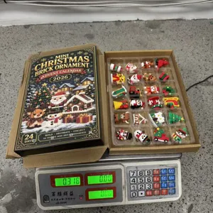 Open advent calendar box with 24 compartments of miniature Christmas brick ornaments