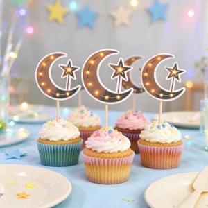 Cupcakes topped with crescent moon and star picks, styled on a pastel party table with soft lights