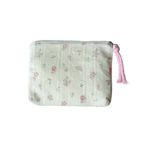 Petite pochette zippée vert clair à fleurs roses, tissu texturé et pompon tressé rose