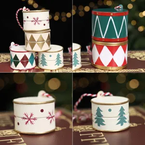 Set of hand-painted drum-shaped Christmas tree ornaments with festive patterns and hanging cords