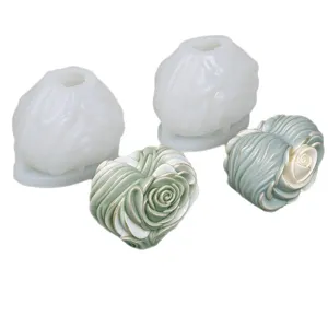 White silicone rose candle mold with sage-green and ivory rose-shaped candles in heart and bud forms