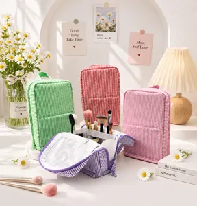 Striped seersucker pouches in four colors, with one open to show makeup brushes inside