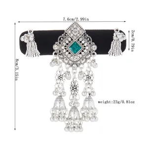 Antique silver-tone ornament with green square gem, crystal accents, bells and hanging tassels