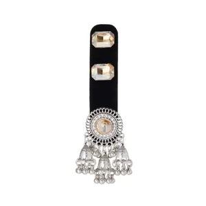 Silver filigree ornament with central crystal, rectangular gems and dangling bell tassels