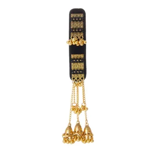 Gold-tone openwork bands with dark accents, dangling chains, beads and bell-shaped tassels.