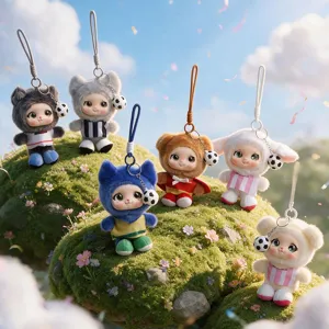 Six football-themed plush animal charms with hanging loops displayed on mossy hills