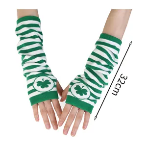 Close-up of green and white striped fingerless arm warmers with shamrock motifs, marked 32 cm