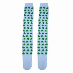 Pair of light blue knee-high socks with green shamrock print, shown side by side on white