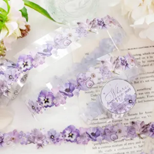 Transparent PET floral washi tape with purple flowers, shown as a roll and a trailing strip