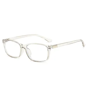 Eckige Brille mit klaren Gläsern, hellem Champagnerrahmen und Metallakzenten an den Bügeln