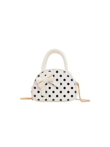 Girls' mini faux leather handbag with black dots, a white bow, top handle and gold chain strap