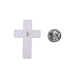 Close-up of the cross pin back, with its straight pin and round butterfly clutch on white