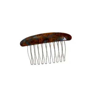 Curved tortoiseshell resin hair comb with fine silver metal teeth, shown alone on a white background