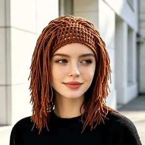 Portrait showing a brown crocheted openwork cap with long yarn dreadlock-style fringe