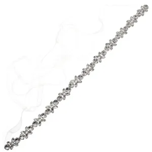 Bridal sash belt with silver crystal flowers and white sheer ties, displayed diagonally on white