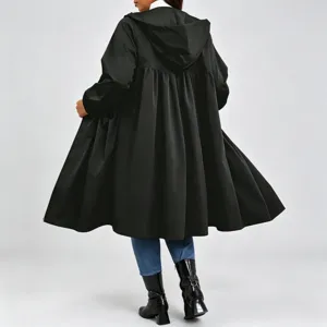 Rear full-length view of a model wearing a black hooded coat with a flared, pleated silhouette