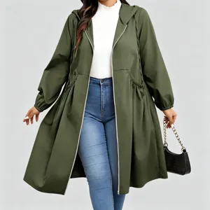 Model wearing an olive green hooded coat with a drawstring waist and relaxed A-line shape