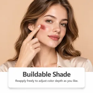 Model dabs buildable rose-red blush onto her cheek with a fingertip, showing its layered color.