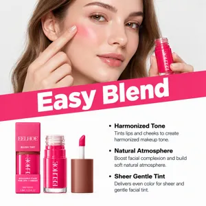 Close-up of a model tapping a sheer pink tint onto her cheek beside the applicator and bottles