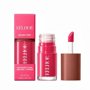 Pink lip and cheek tint shown with box, glass bottle and applicator on a white background
