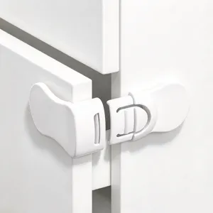 White plastic child safety cabinet lock with interlocking catches, shown fitted on cupboard doors