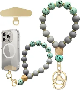 Two beaded straps in sage green and gray with wooden accents, gold clips and phone attachments
