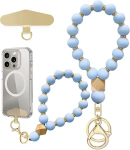 Light blue beaded wrist straps with gold spacers, wooden beads, hooks, phone patch and clear case