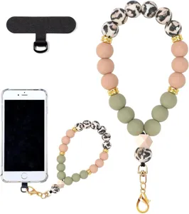 White-background view of a beaded wrist strap with leopard-print beads, gold hardware and phone tab