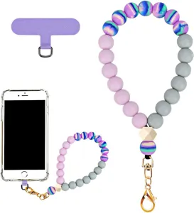 Flat lay of pink and gray beads, iridescent accents, wooden bead, gold clasp and purple phone tab
