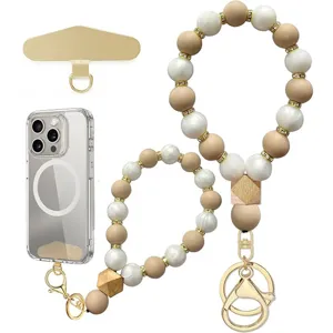 Beaded phone wrist strap in ivory and tan silicone beads with gold-tone hardware, shown as a set