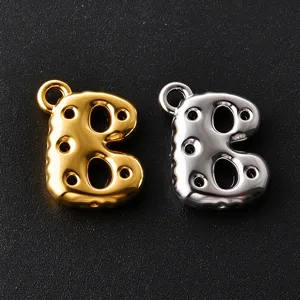 Gold and silver bubble-letter B charms with loops and glossy circular cutout details