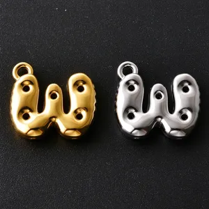 Close-up of smooth balloon-style W charms in gold and silver, with loops and three holes