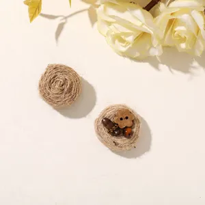 Two round jute decorations, one spiral-wrapped and one with a wooden flower button and beads