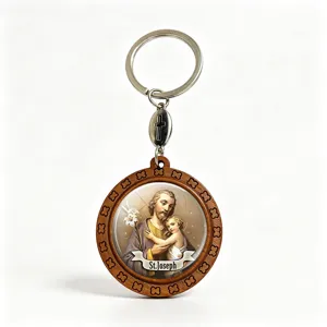 Round wooden St. Joseph keychain with engraved floral border, metal split ring and cross charm